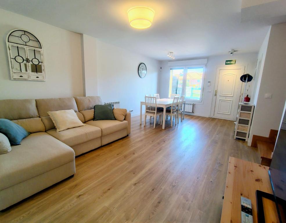 a living room with a couch and a table at Capricho de Rovacías in Comillas