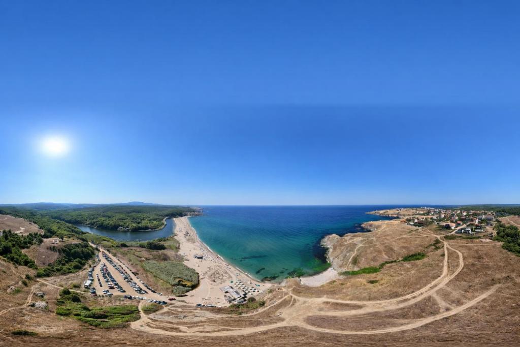 an aerial view of a beach and the ocean at Къща Мариела in Sinemorets