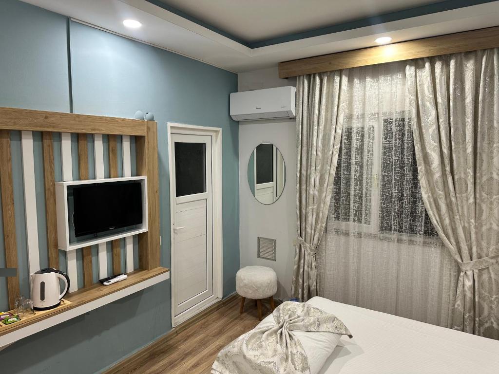 فضای داخلی Amsterdam Otel Economic Room در آنتالیا - تصویر ۳