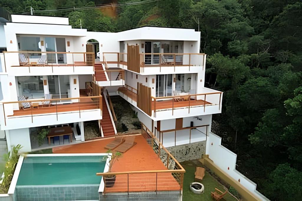 an aerial view of a house with a swimming pool at Artha Home Spa in Governador Celso Ramos