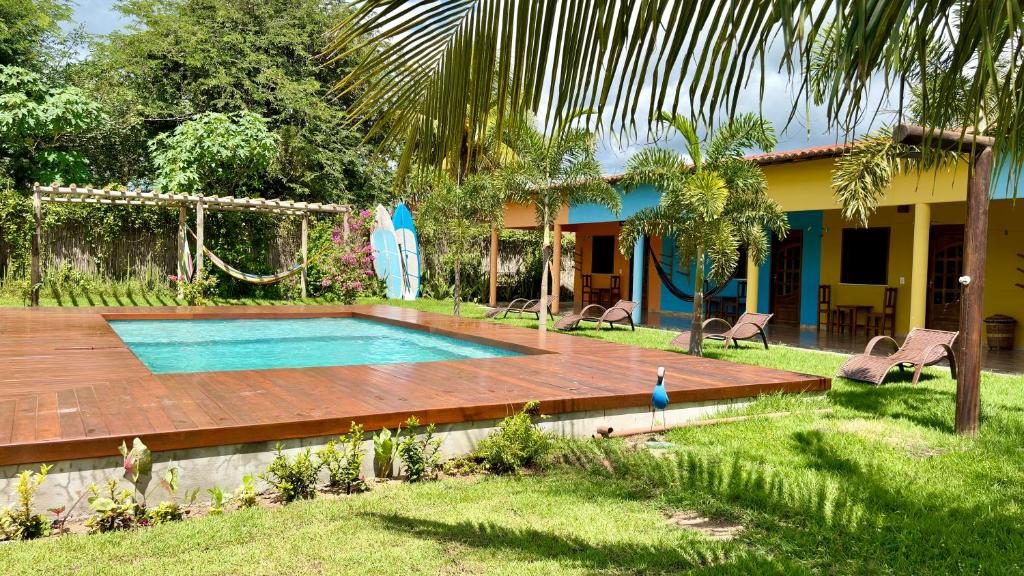 a house with a swimming pool in a yard at The Jungle, Guriú, CE in Guriú