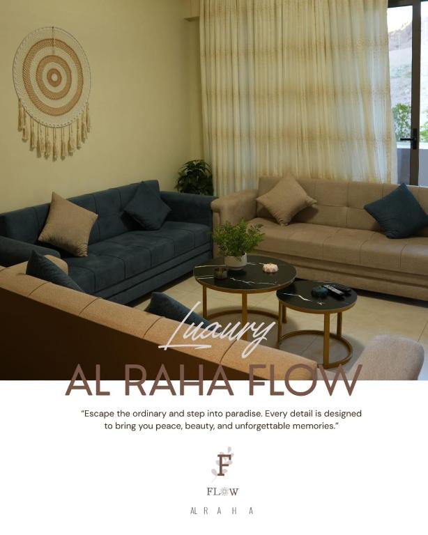 a living room with a couch and a table at Flow - Al Raha Village in Aqaba