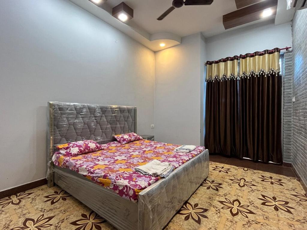 a bedroom with a bed in a room at 2BHK Ground Floor Private House- Raj Shila in Kānpur