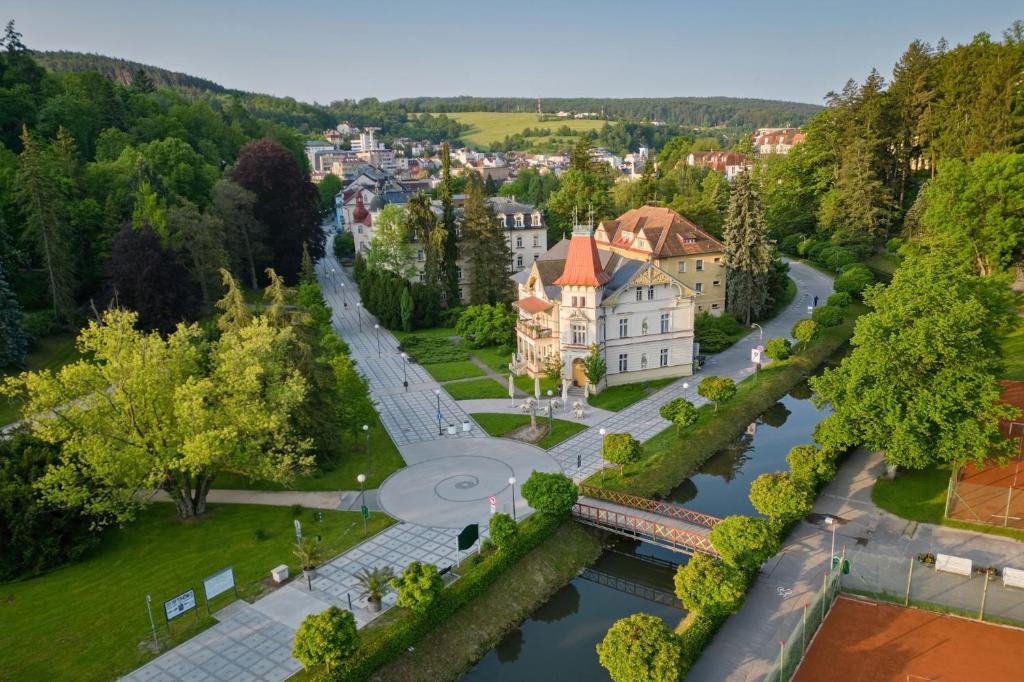 an aerial view of a town with a river at Garsonka - Luhačovice in Luhačovice