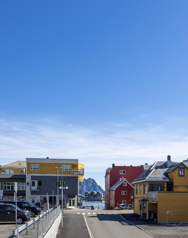 a view of a town with mountains in the background at Storgata 49 Appartements Svolvær in Svolvær