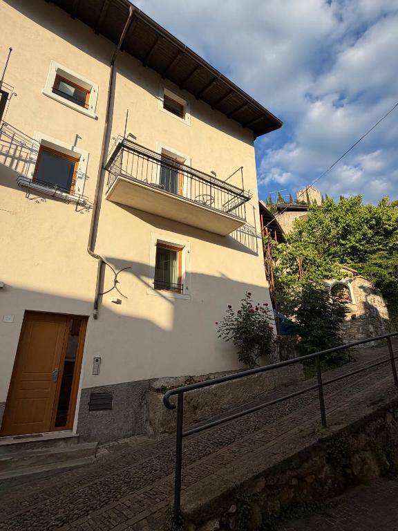 a building with a balcony on the side of it at Castle Rhythm in Arco