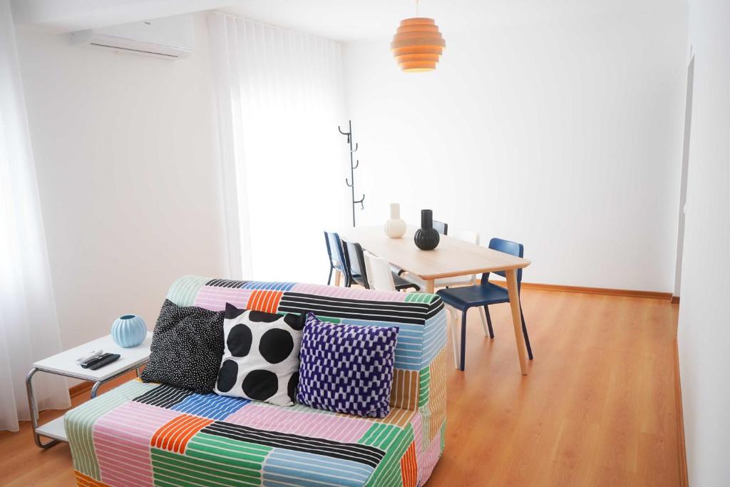 a living room with a couch and a table at Horta Joy! in Horta
