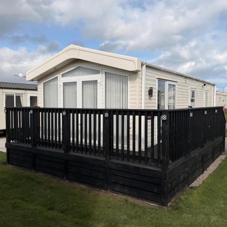 a black fence in front of a house at D2 Shanlieve in Kilkeel