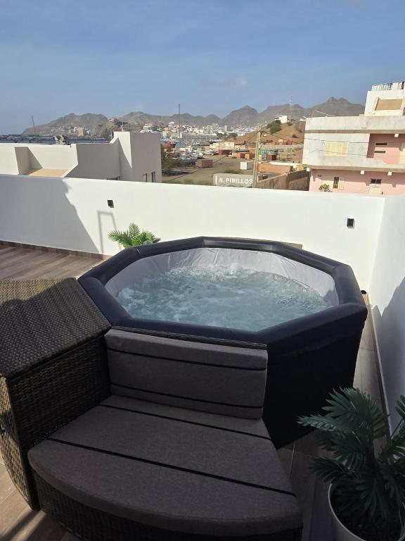 a hot tub on the roof of a building at Tina Bay in Mindelo