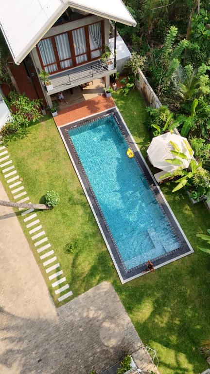 an overhead view of a swimming pool in a yard at Villa Ema in Galle
