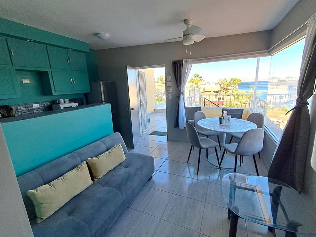 a living room with a couch and a table at Turquesa by the Sea, Elevated Ocean View Retreat in San Carlos