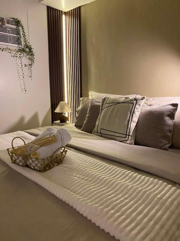 a large white bed in a room at Casa Primo in Biñan
