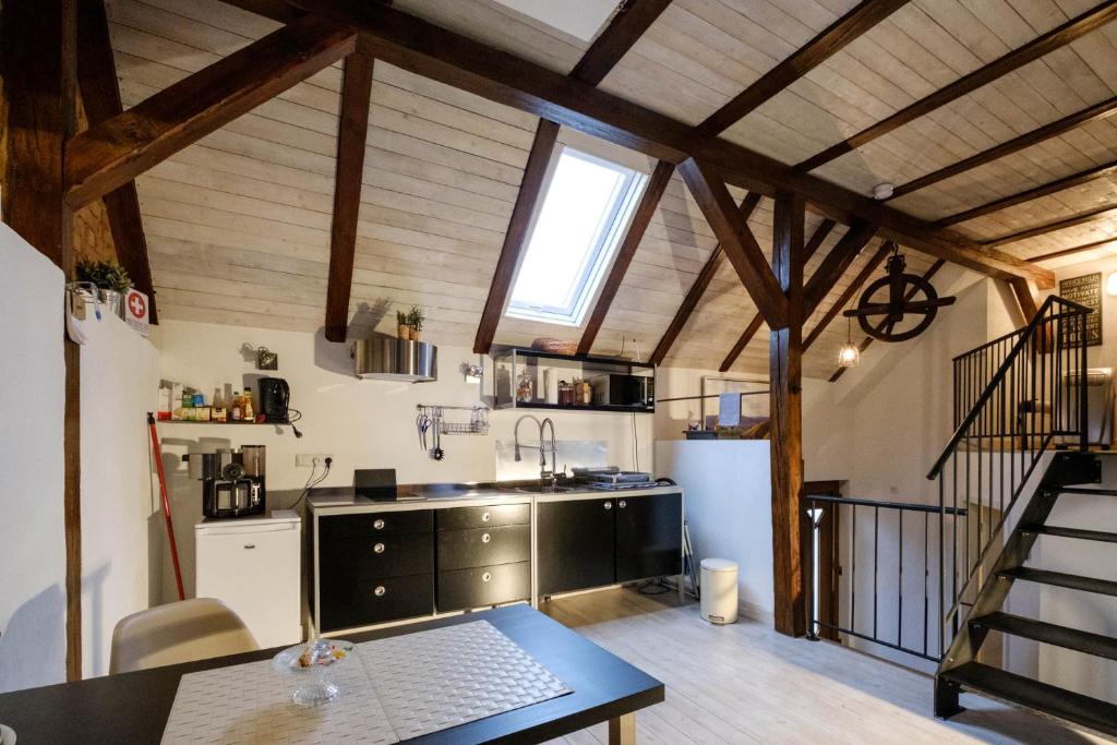 a kitchen with a sink and a counter in a room at Apartment Bleibe in Besigheim