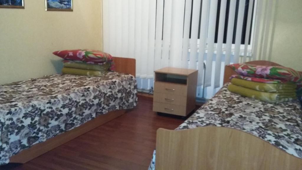 Postel nebo postele na pokoji v ubytování Hotel Yuvileyny