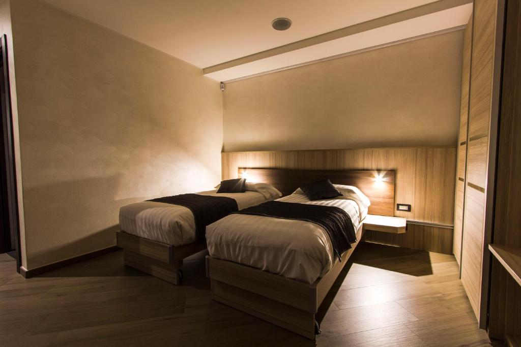 Postel nebo postele na pokoji v ubytování Mito Hotel