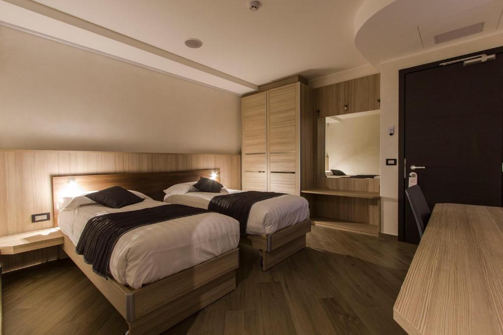 Postel nebo postele na pokoji v ubytování Mito Hotel
