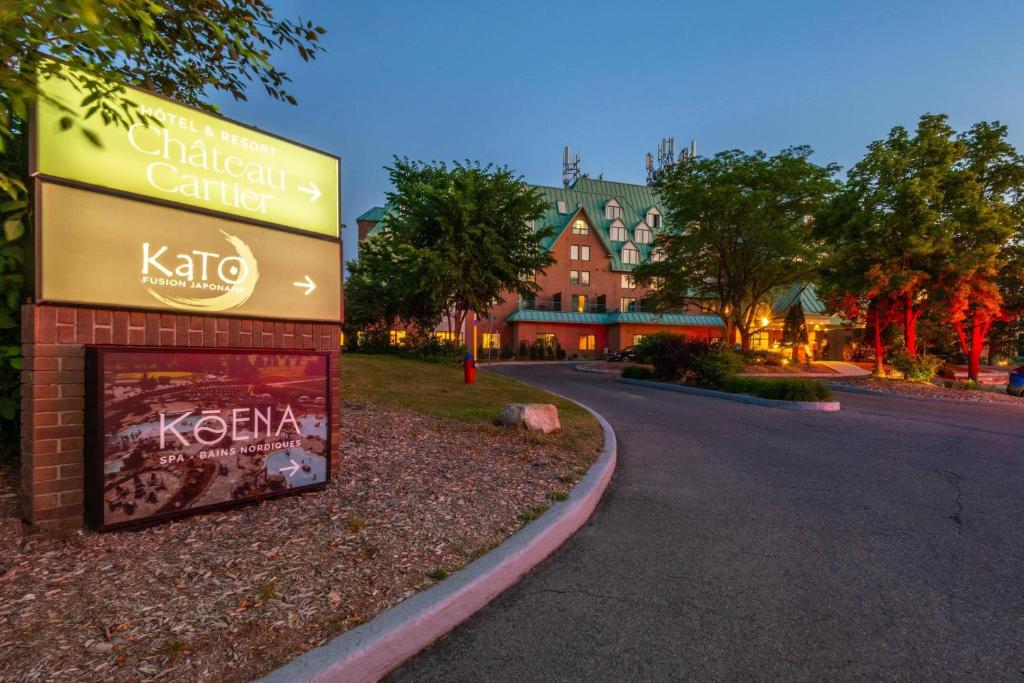 a sign for a kotin center next to a street at Chateau Cartier Hotel & Resort, an Ascend Collection Resort in Gatineau