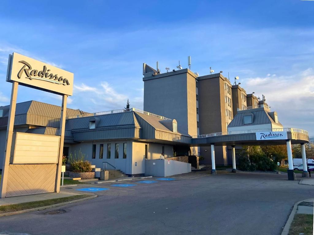 a hotel with a sign in front of a building at Radisson Hotel & Conference Centre Edmonton in Edmonton