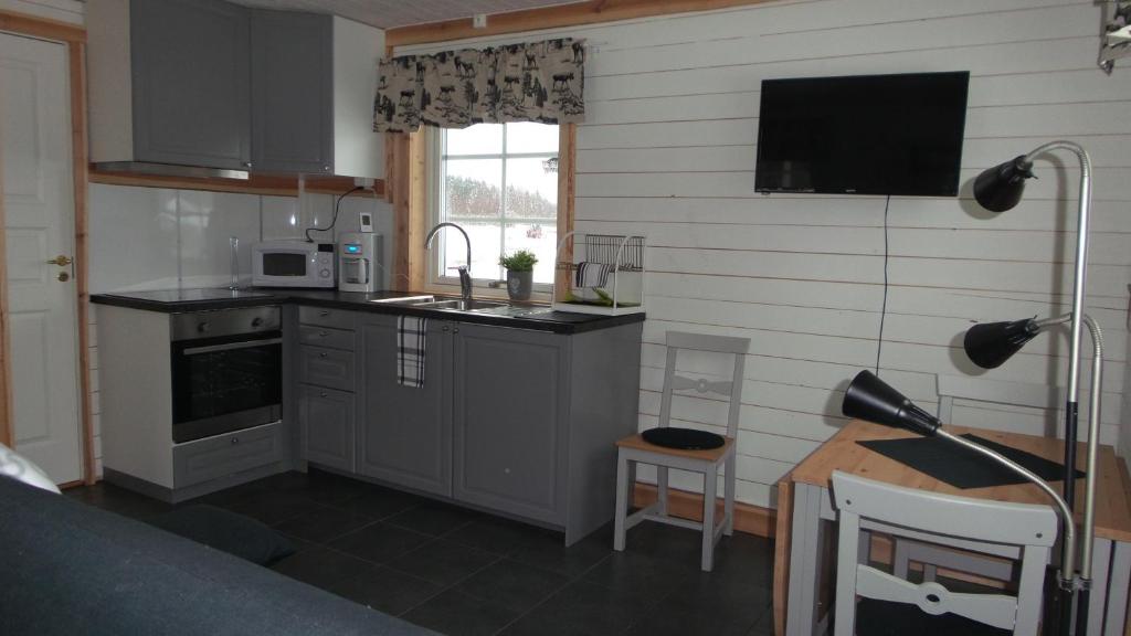 Kuchyň nebo kuchyňský kout v ubytování Sörmarks Camping
