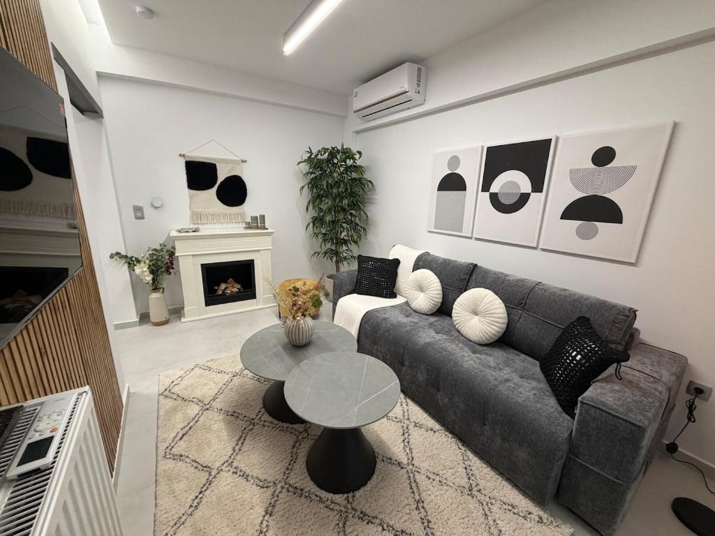 a living room with a couch and a table at West Athens Luxurius Apartment in Athens