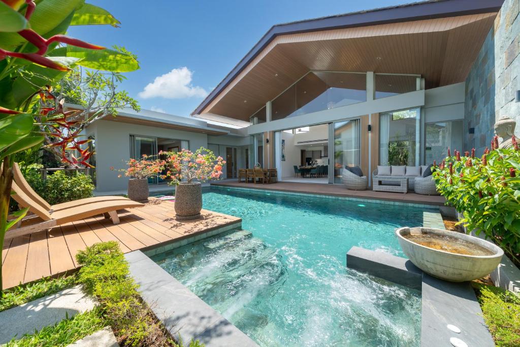 a swimming pool in the backyard of a house at Wila villas Phuket Free Airoport Pick up from 7 days in Phuket