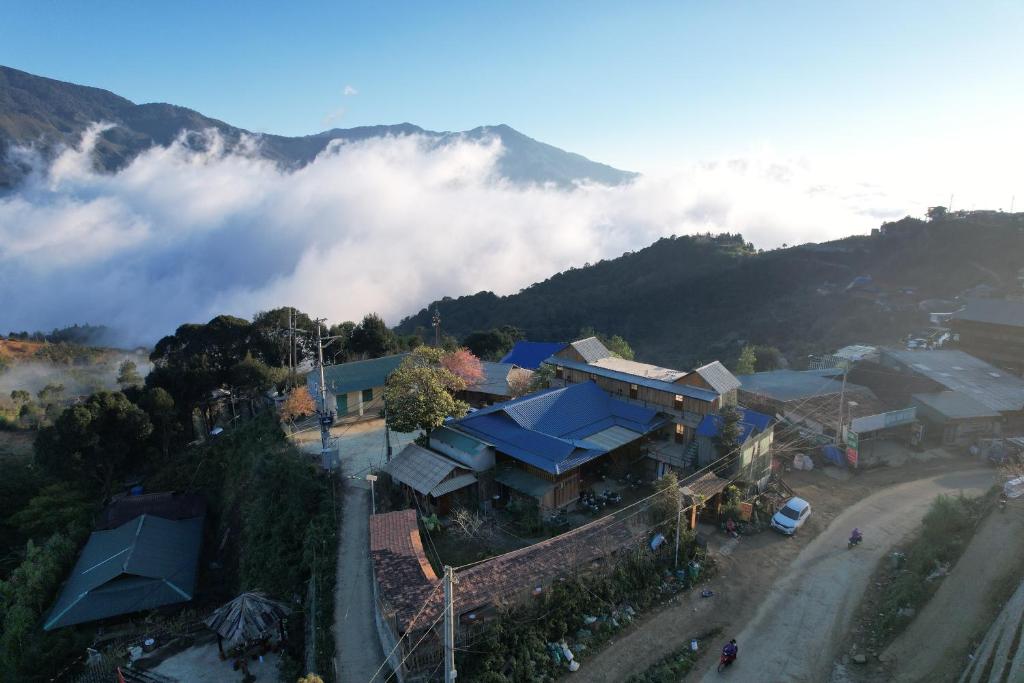 an aerial view of a house in the clouds at A Phủ Home's Tà Xùa in Bắc Yên