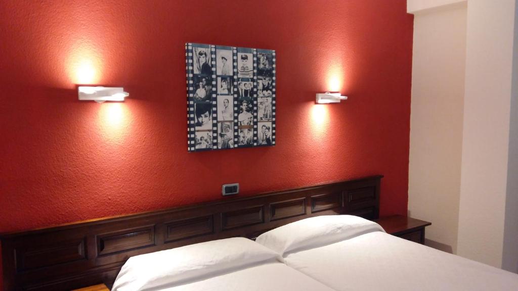 Postel nebo postele na pokoji v ubytování Hotel Tejuma