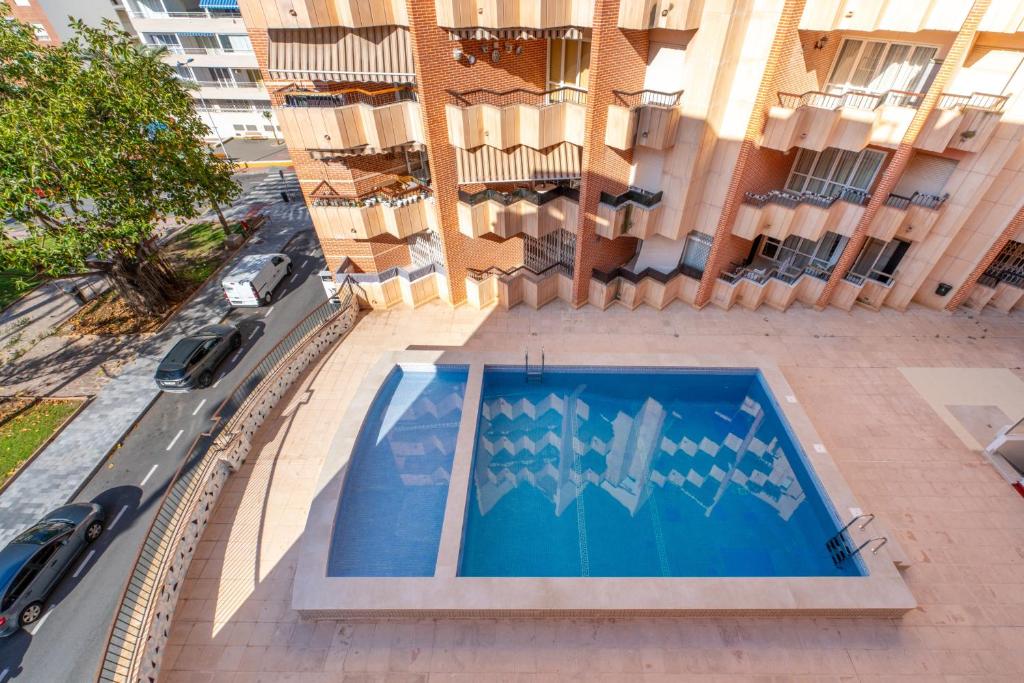 an overhead view of a building with a swimming pool at Mar y Sol in Torrevieja