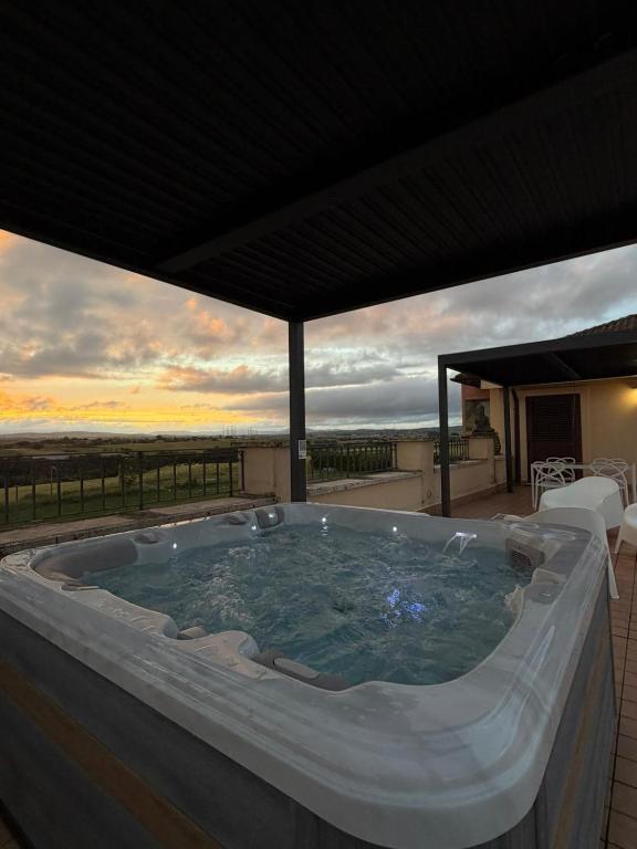 a large hot tub on a patio with a sunset at Puesta del Sol Roma in Rome