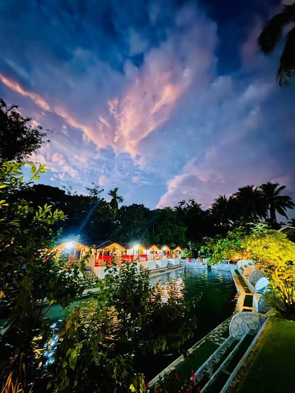 a view of a pool at night at Tuburan Resort in Panong