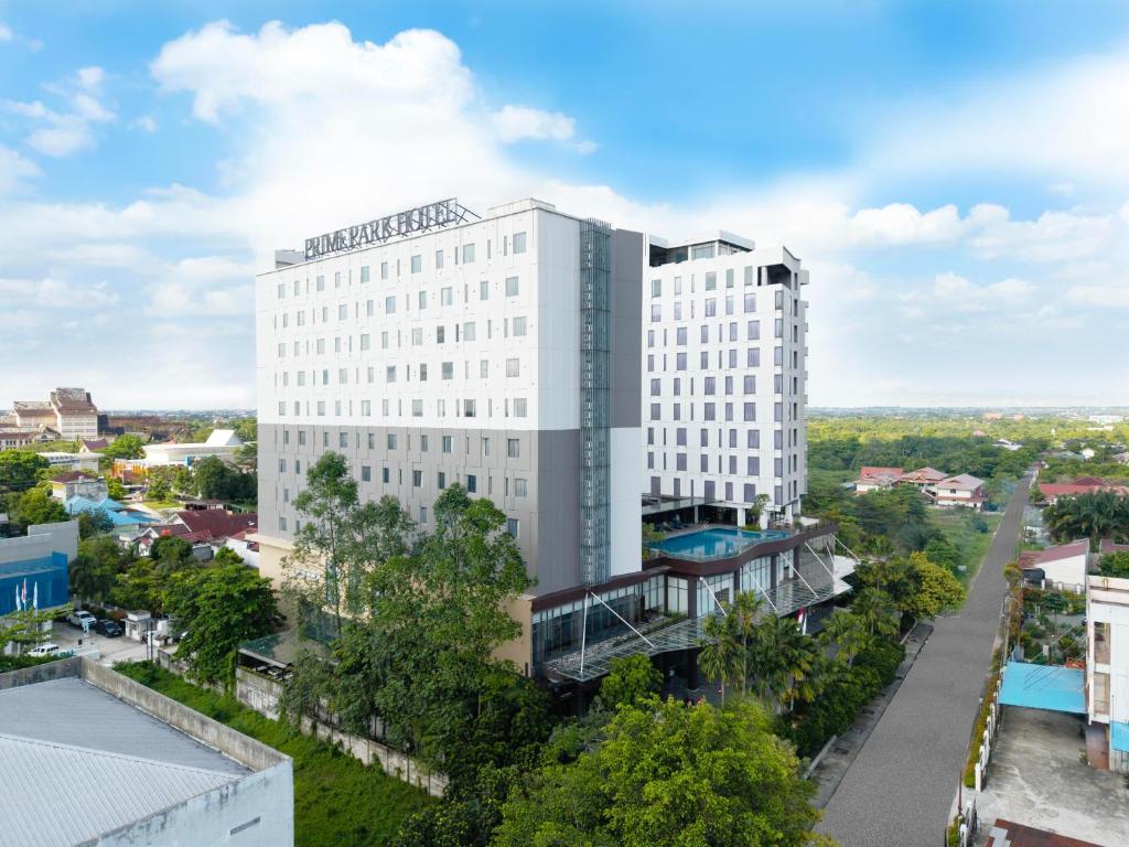 an aerial view of a white building at PRIME PARK Hotel & Convention Pekanbaru in Pekanbaru