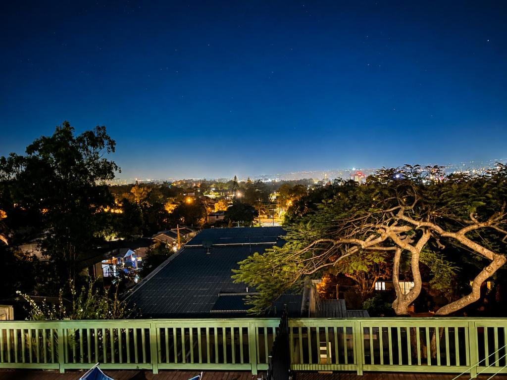 a view of a roof of a house at night at Sunlit Lodge in Rochedale South