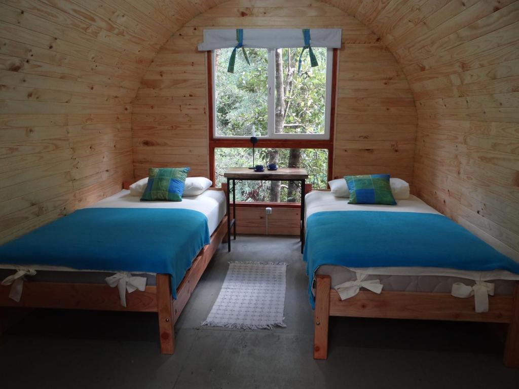 Un pat sau paturi într-o cameră la Huincaterra