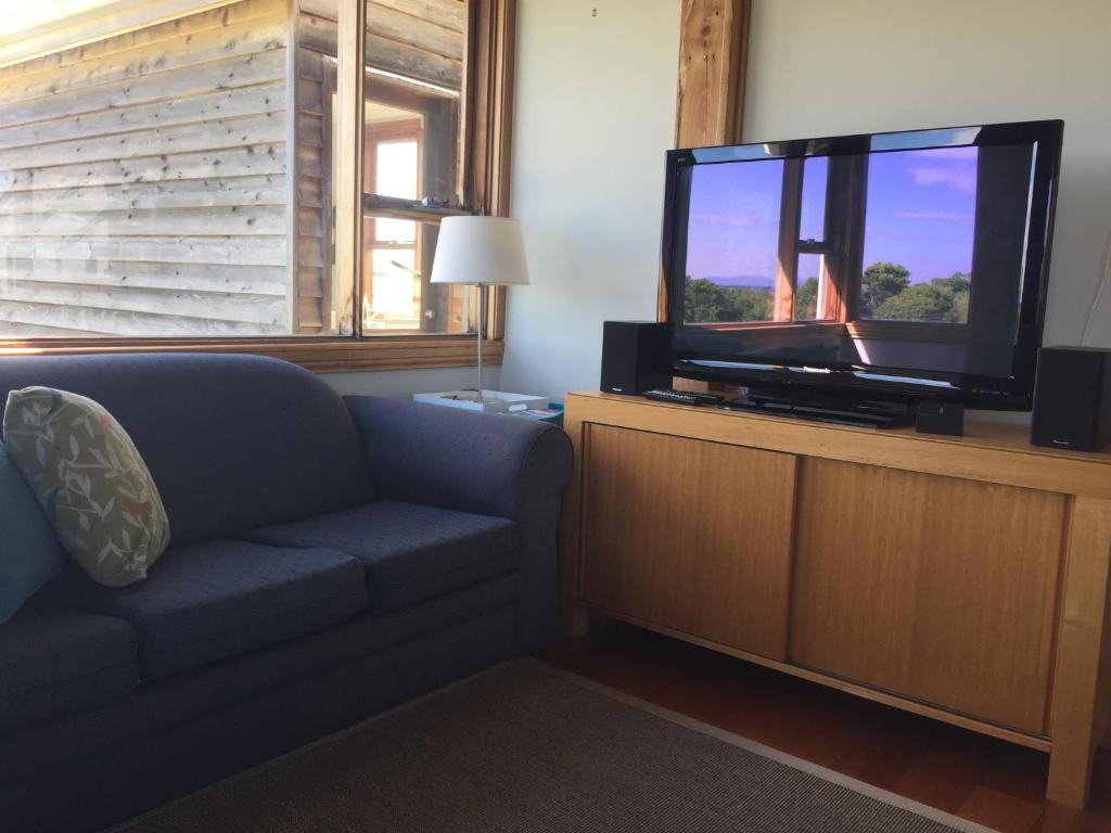 A television and/or entertainment center at Dolphin Beach House