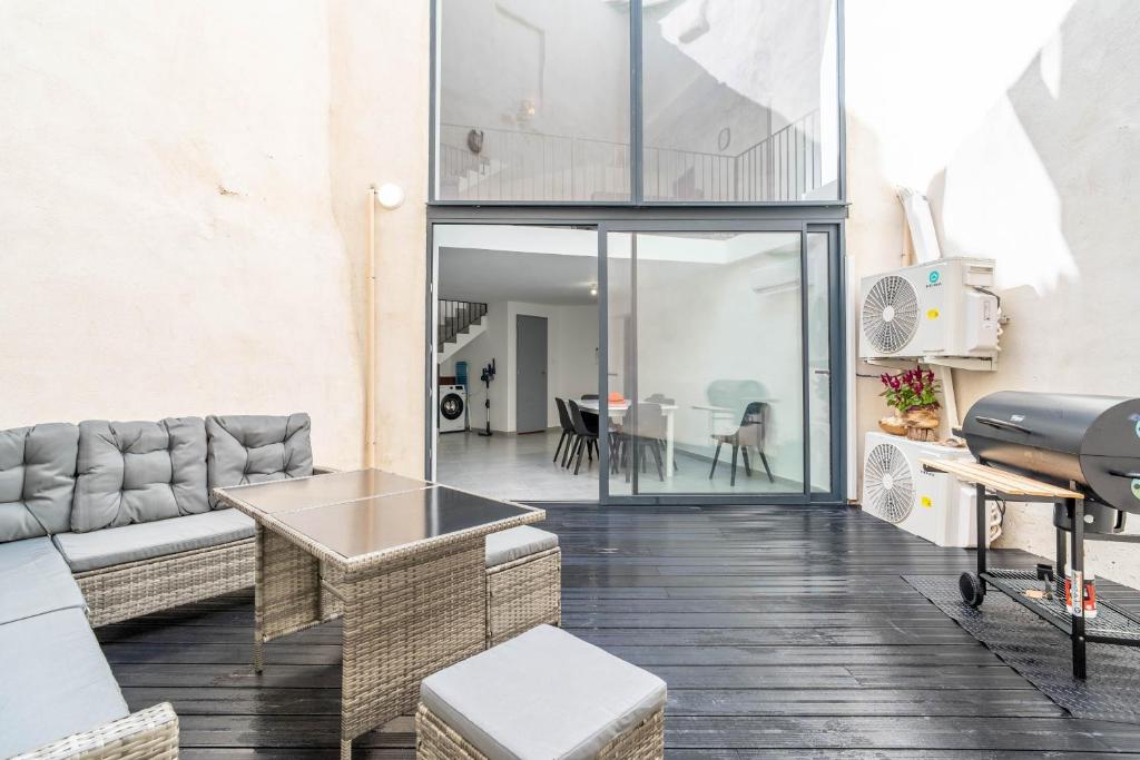 a living room with a couch and a table at Secret Garden in Vias
