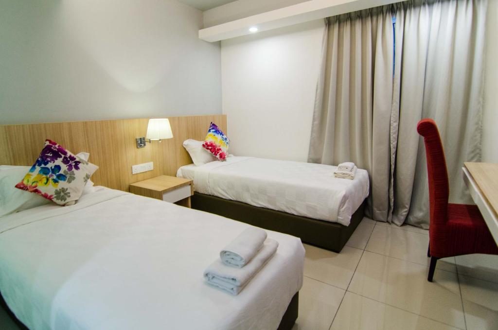 Postel nebo postele na pokoji v ubytování Mornington Hotel Waterfront Lumut