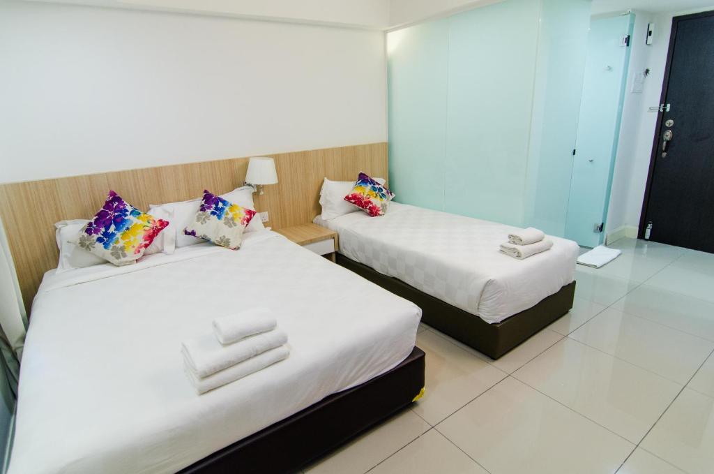 Postel nebo postele na pokoji v ubytování Mornington Hotel Waterfront Lumut