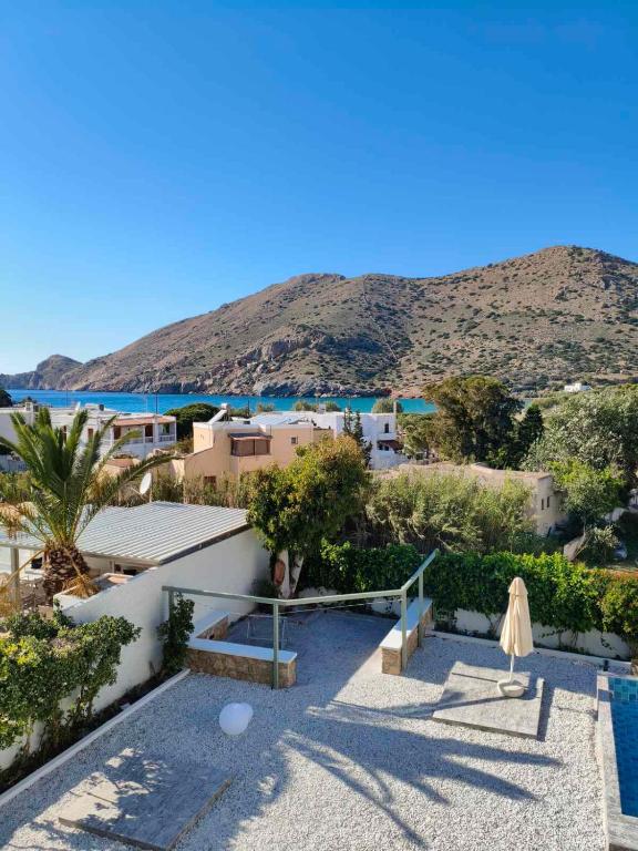 a resort with a view of the water and mountains at Seaview Apartment in Galissas - Blue Lagoon Complex A9 in Galissas