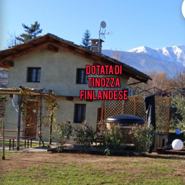 a house with a sign on the side of it at 'L ciabot 'd Ginota in Barge