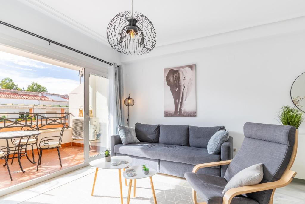 a living room with a couch and a table at Calpe Bay Masnou 24 in Calpe