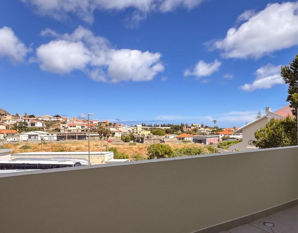 a view of a city from a balcony at Refúgio dos Arrifes in Vila Baleira