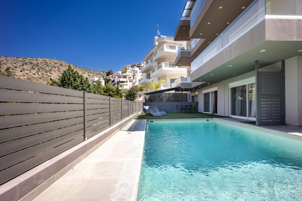 a swimming pool in front of a building at Athenean Pool Break in Athens