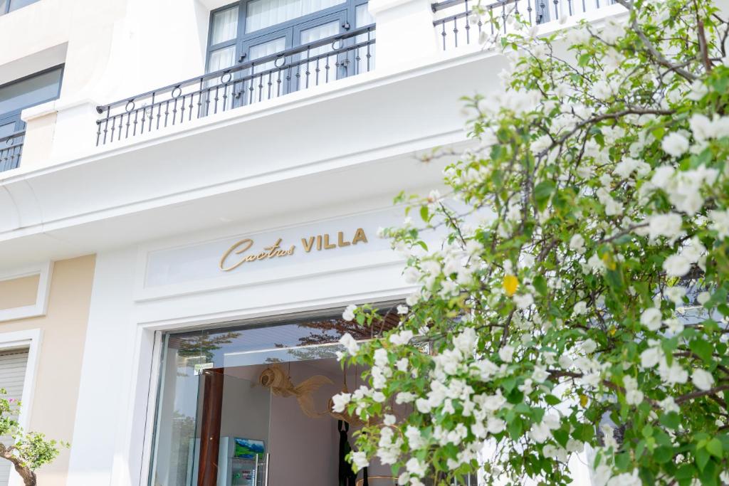 a white building with a sign that reads canyon villa at Cactus Villa in Dong Hoi