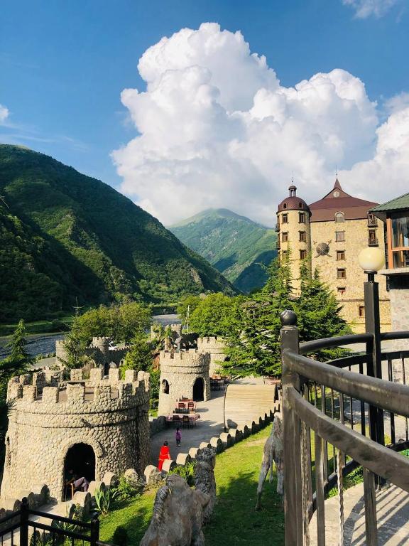 a view of a castle with mountains in the background at Senger Qala Riverside in Qax