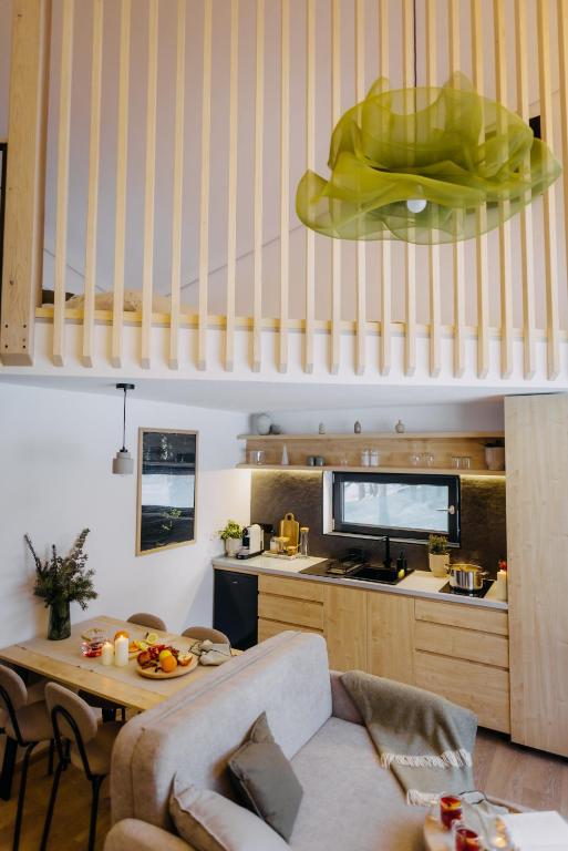 a living room with a couch and a table at Monside Resort - EARTH CABIN in Borzont