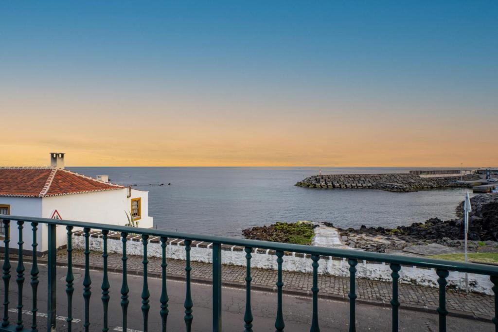 a view of the ocean from a balcony at Sao Mateus Ocean View in São Mateus