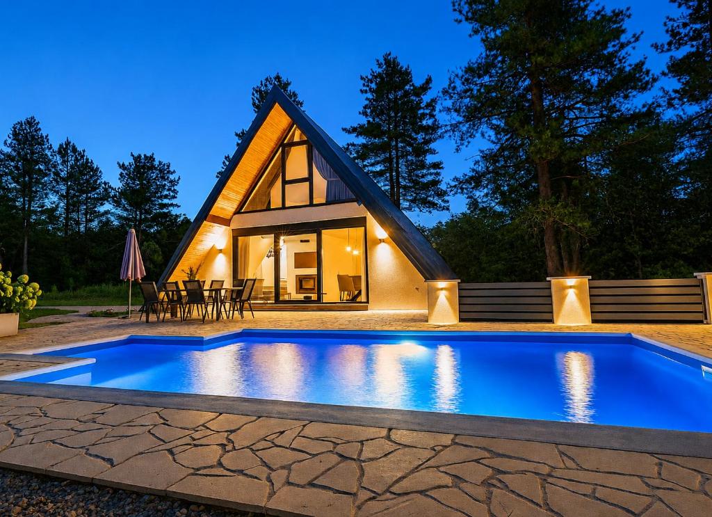 a cabin with a pool in front of a house at Holiday home Pine nest in Široki Brijeg