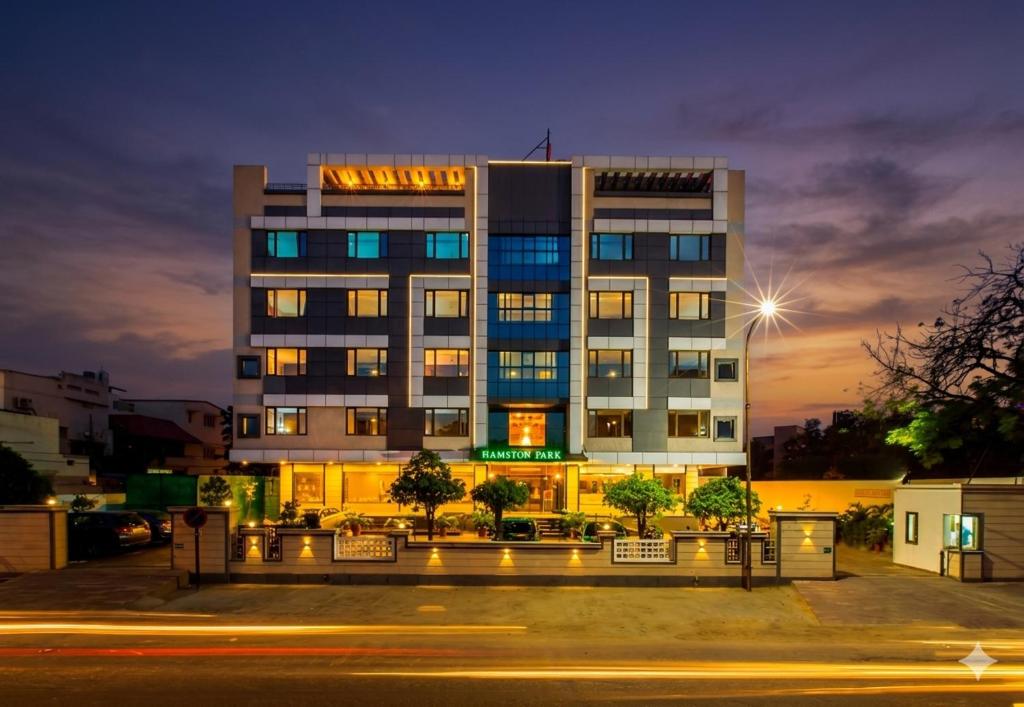 a building with a lit up sign on it at Hotel Golden Manor-City Center Bani Park in Jaipur