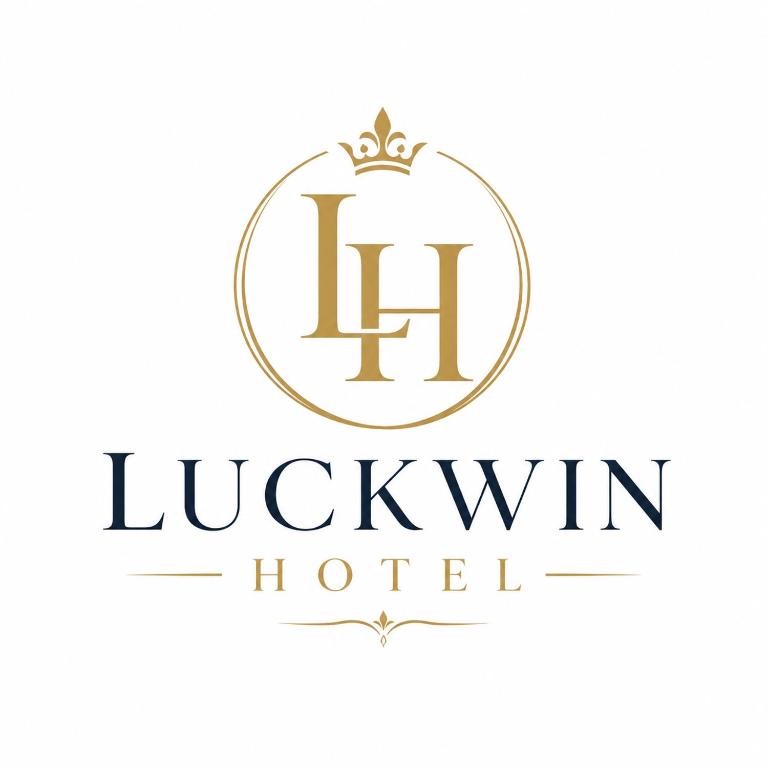 a logo for a luxury hotel with a gold crest at Luckwin Guest in Anuradhapura