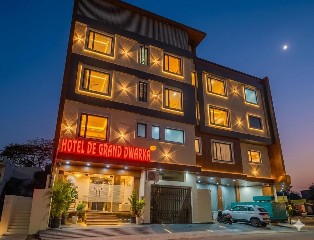 a building with a sign that reads hotel be grand singing at Hotel De Grand Dwarka-Near Jaipur Airport in Jaipur